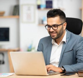 Portrait of a handsome young businessman working in office Portrait of a handsome young businessman working in office